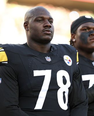 James Daniels #78 of the Pittsburgh Steelers stands on the sidelines during the national anthem prior to an NFL preseason football game against the Tampa Bay Buccaneers at Raymond James Stadium on August 11, 2023 in Tampa, Florida.